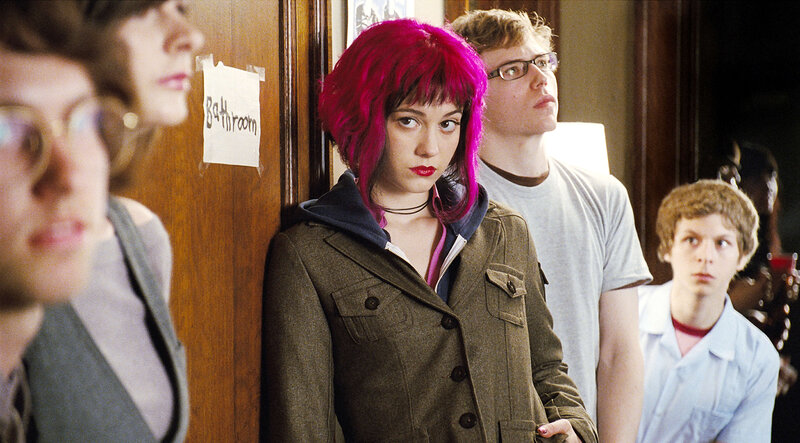 Teen with pink hair in hallway