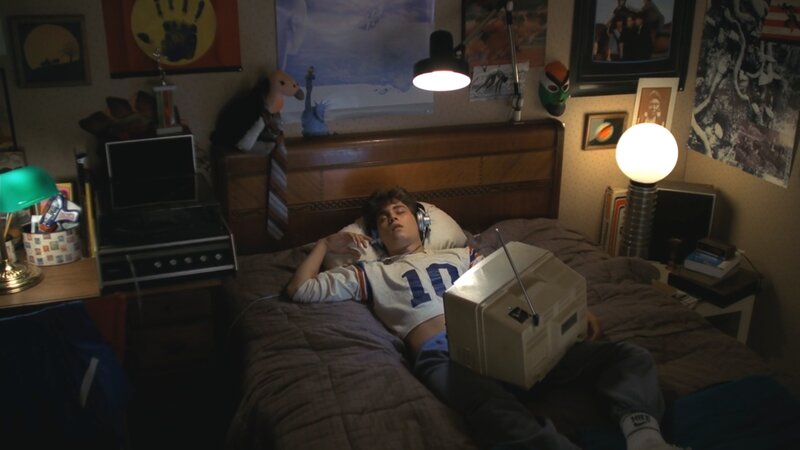 Teenager Lying in Bed