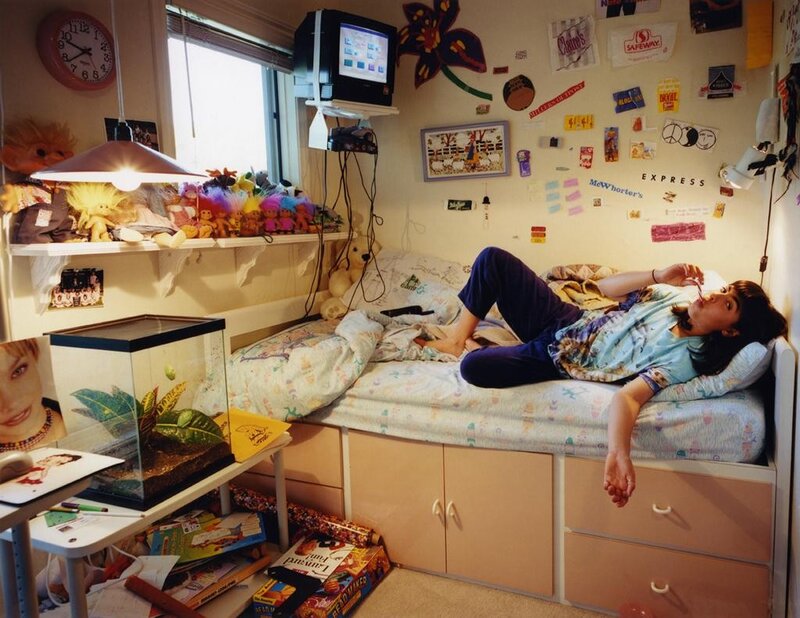 Teenager relaxing in bedroom