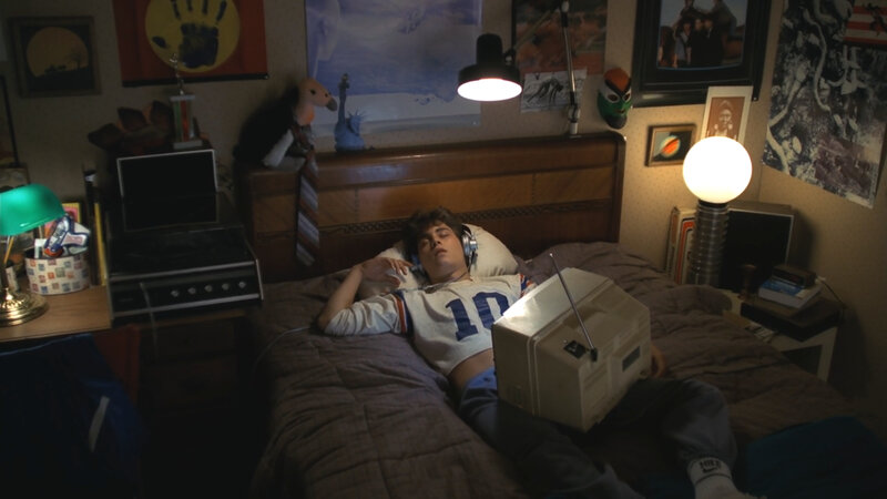 Teenager sleeping in bedroom