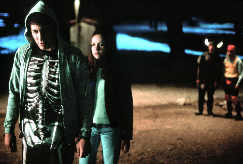 Teenagers in costumes at night