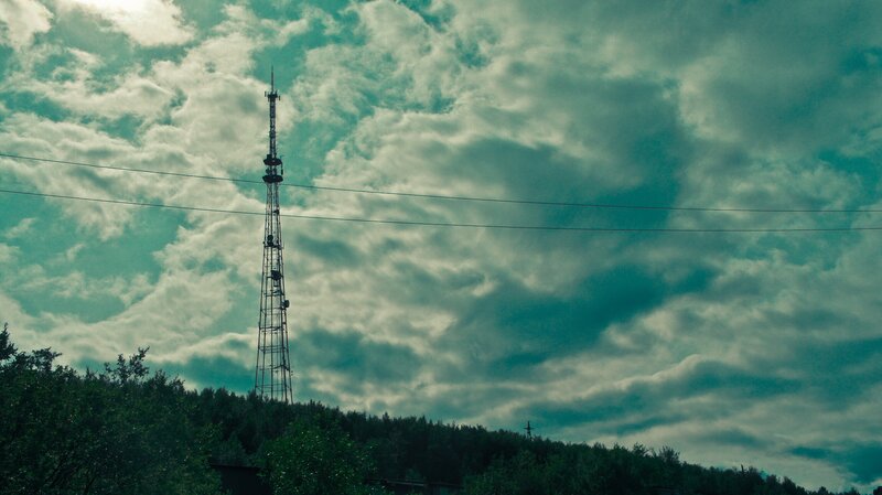 Telecommunication tower on a cloudy day