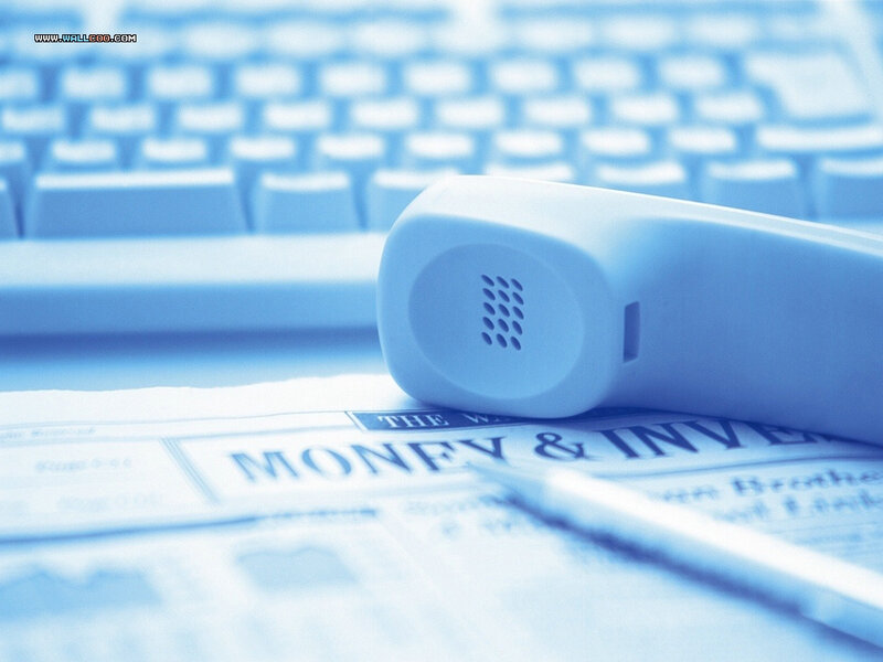Telephone on financial newspaper