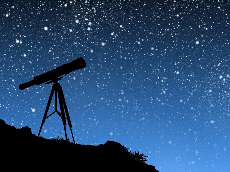 Telescope under starry sky