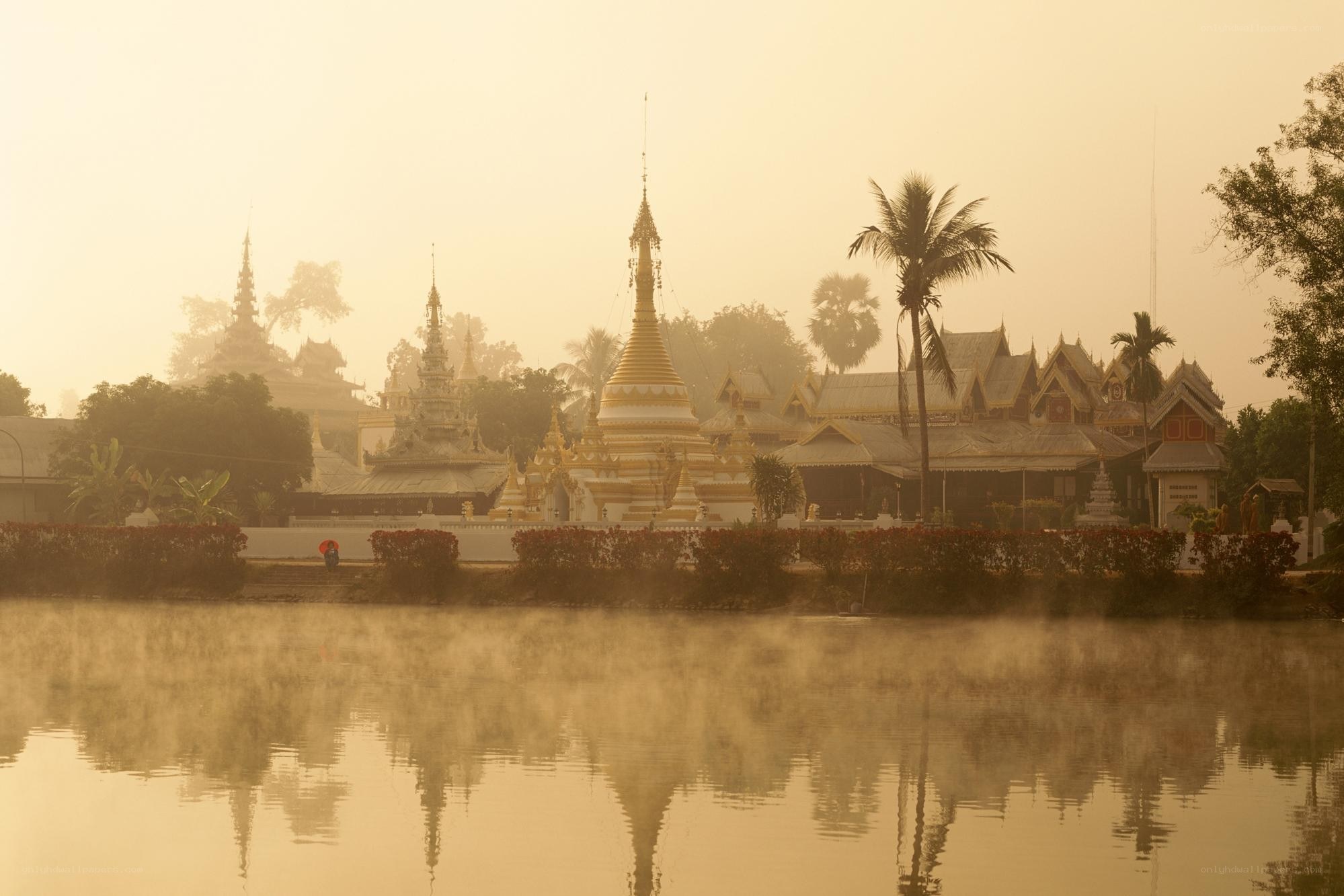 Temple at dawn with mist