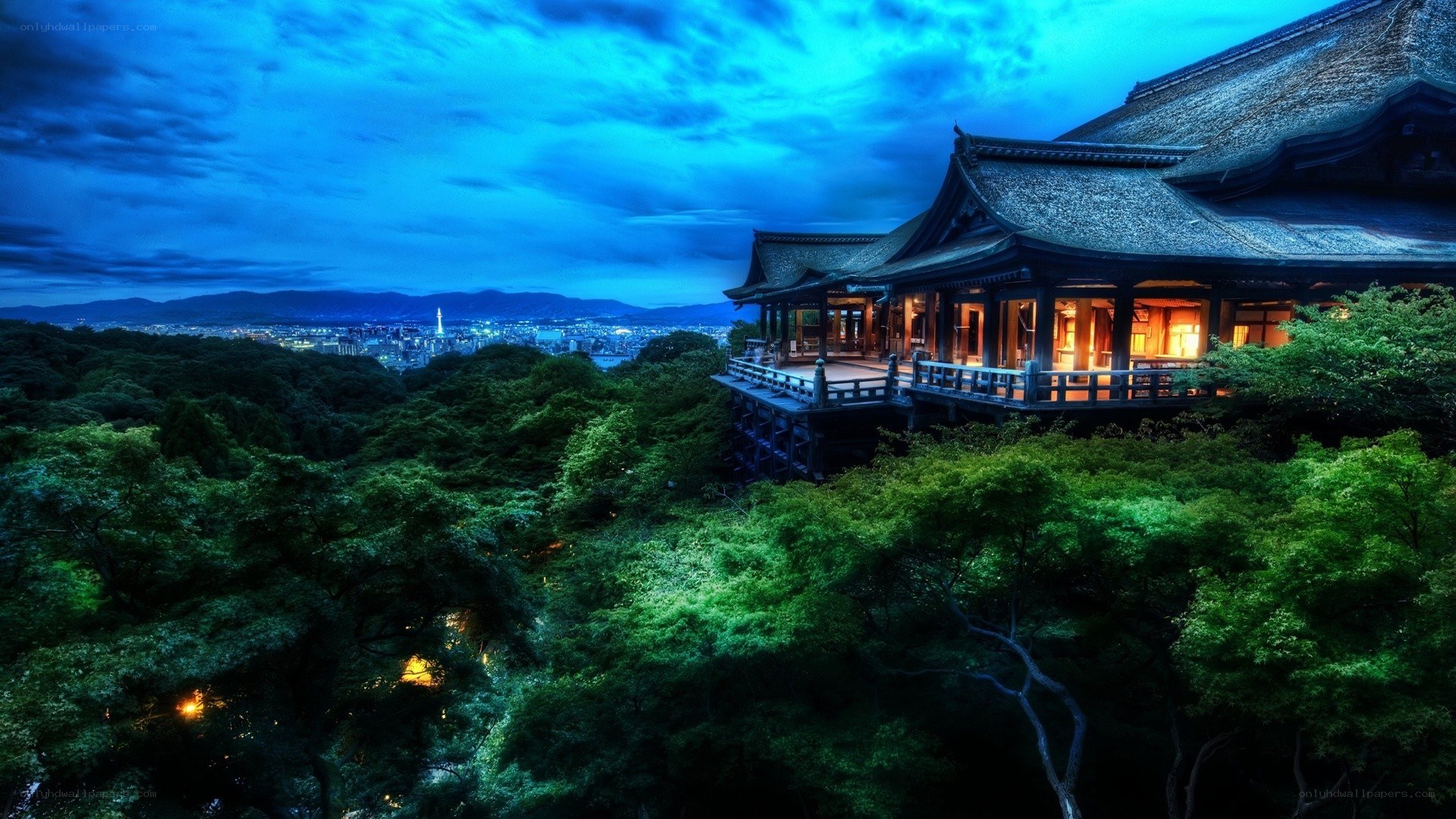Temple overlooking city at dusk