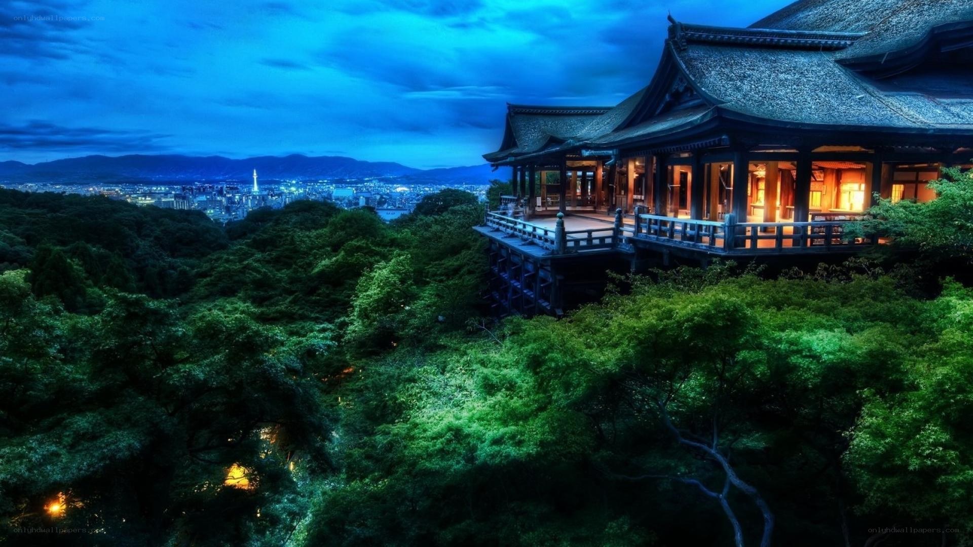 Temple overlooking city at dusk