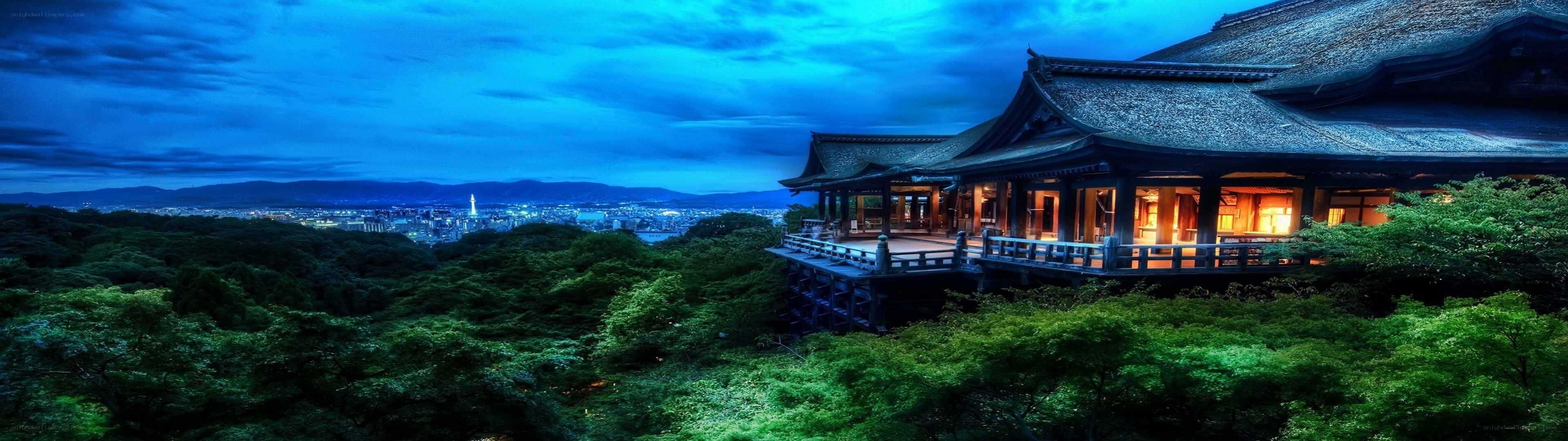 Temple overlooking city at dusk