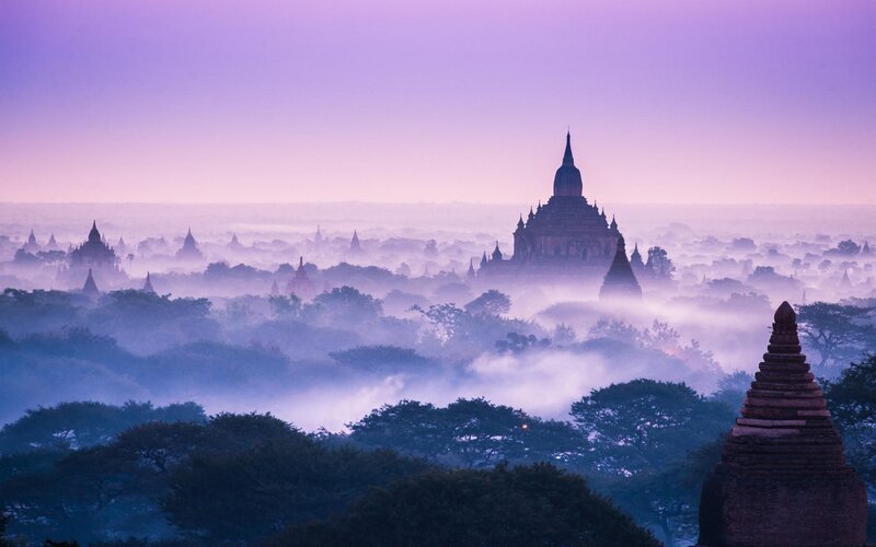 Temples in Misty Landscape