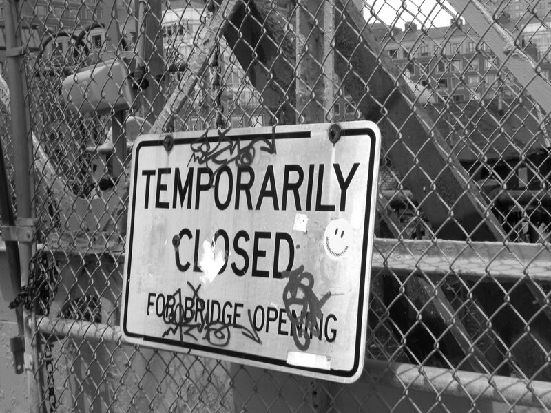 Temporarily closed sign on fence