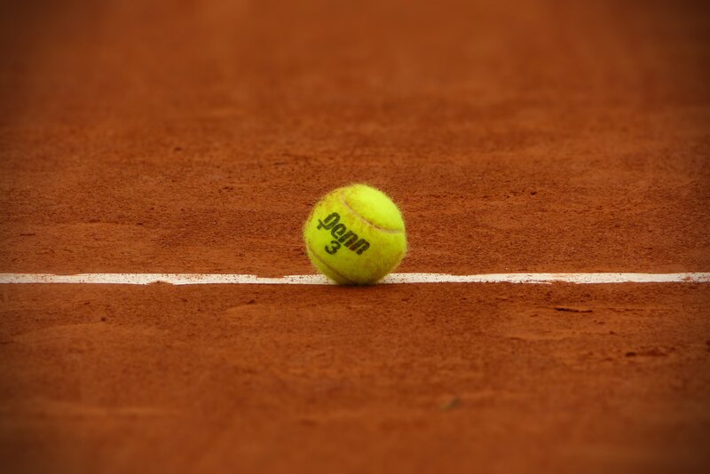 tennis ball on clay court