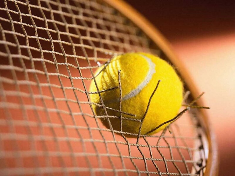 Tennis Ball on Racket — Yellow