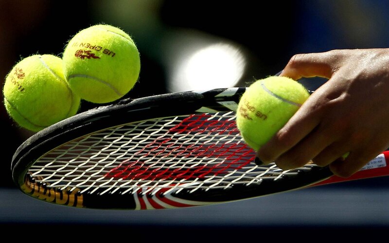 tennis balls and racket