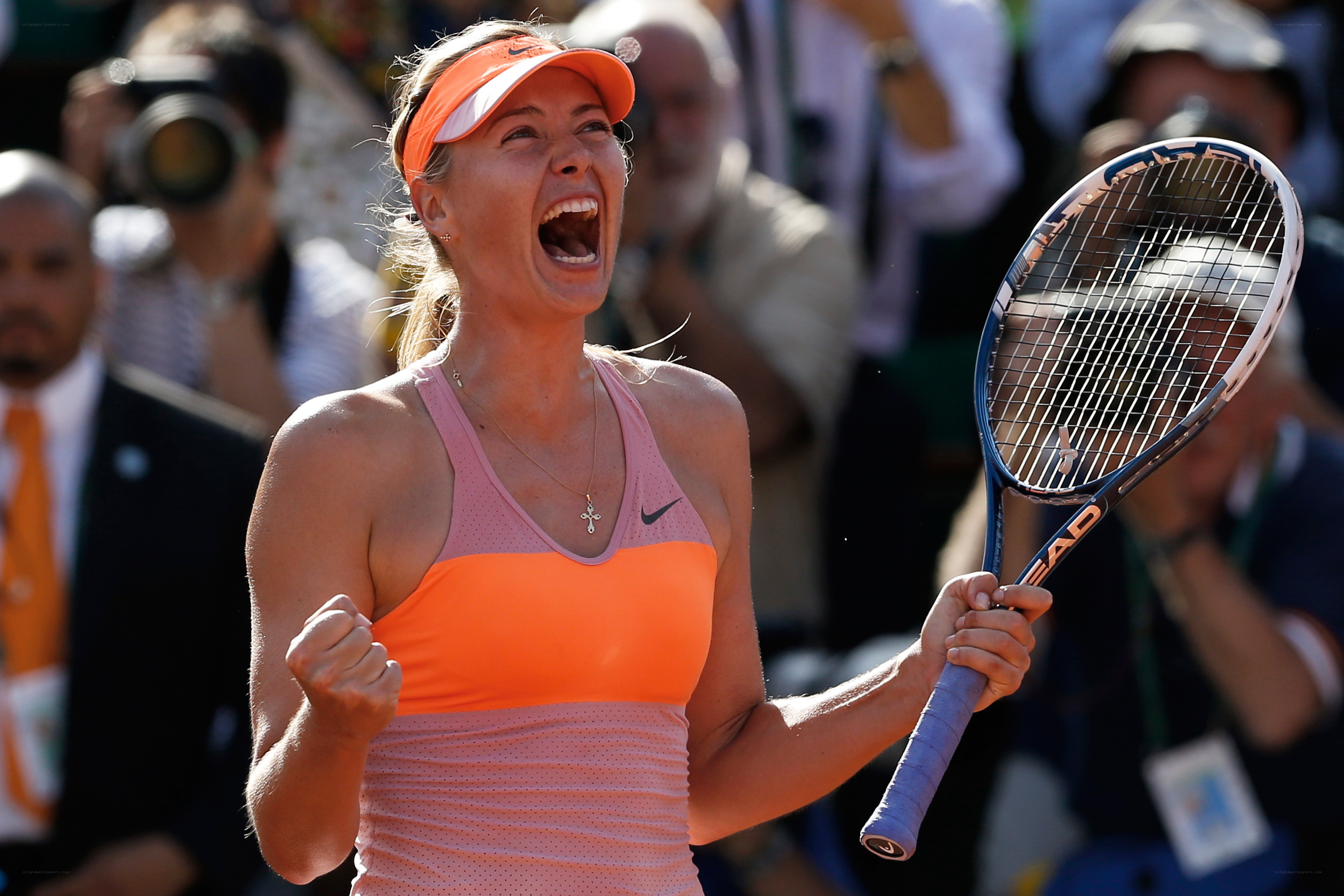 tennis player celebrates victory