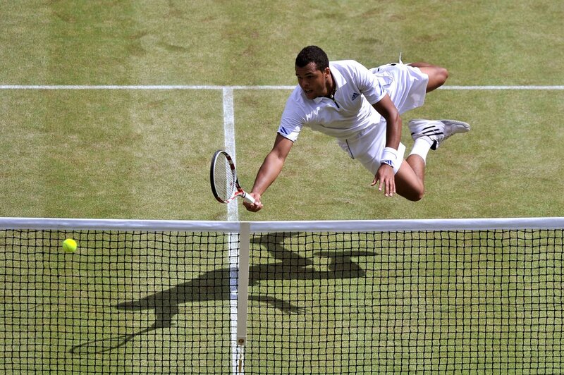 tennis player diving for ball
