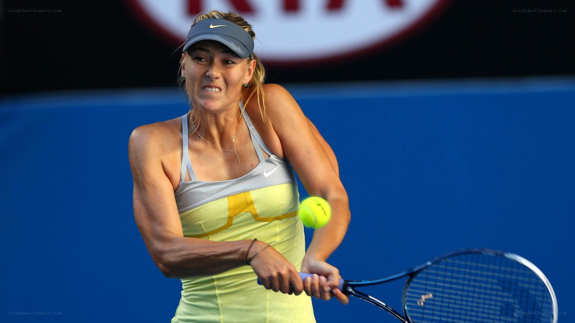 tennis player hitting a ball