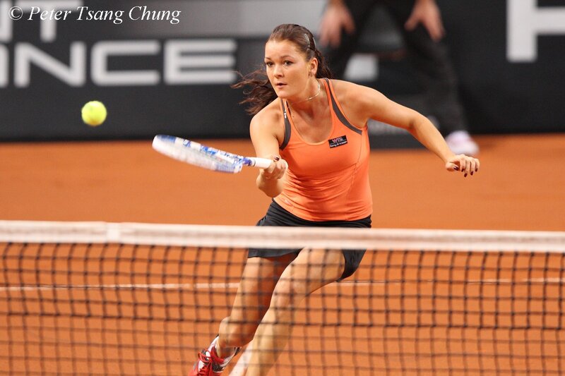 tennis player hitting ball