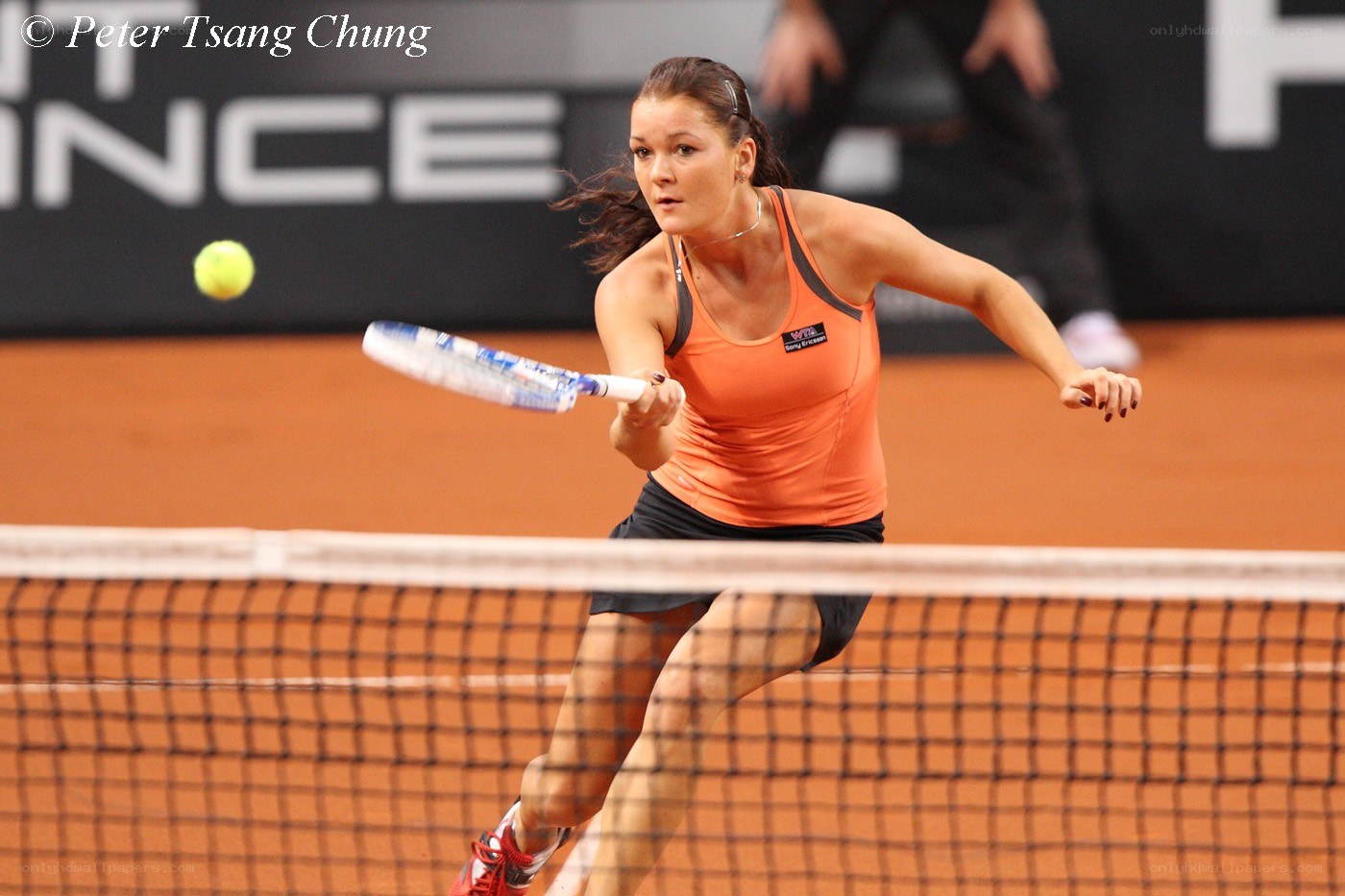 tennis player hitting ball