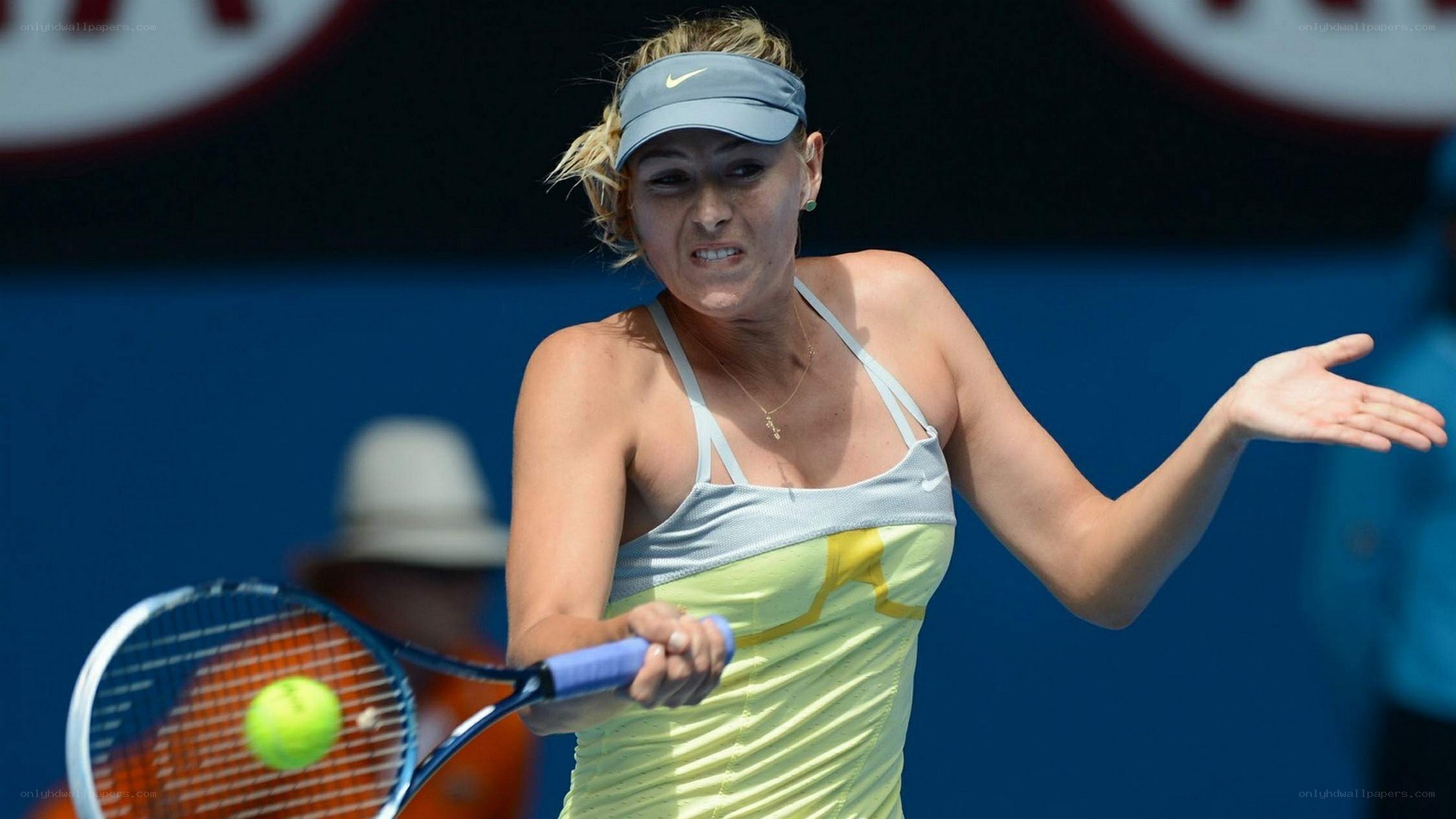 tennis player hitting ball