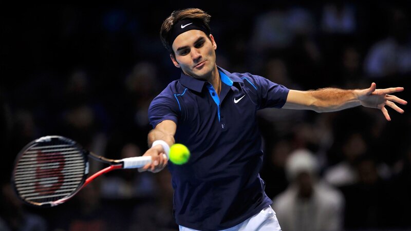 tennis player hitting ball