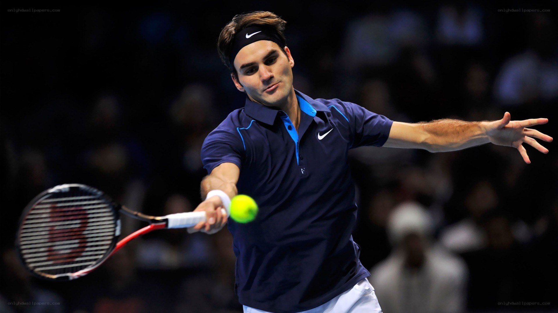 tennis player hitting ball