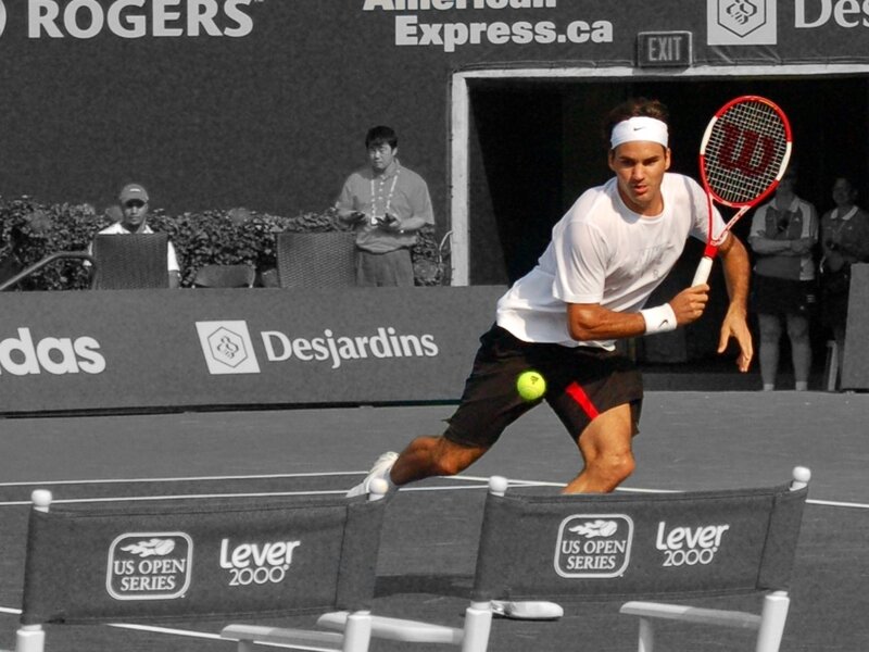 Tennis Player Hitting Ball — Black