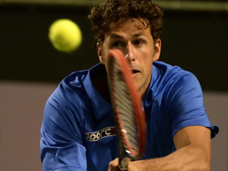 Tennis Player Hitting Ball — Blue, Focused, Night, Photograph