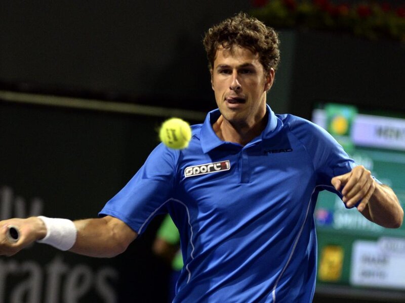 Tennis Player Hitting Ball — Blue, Focused, Night