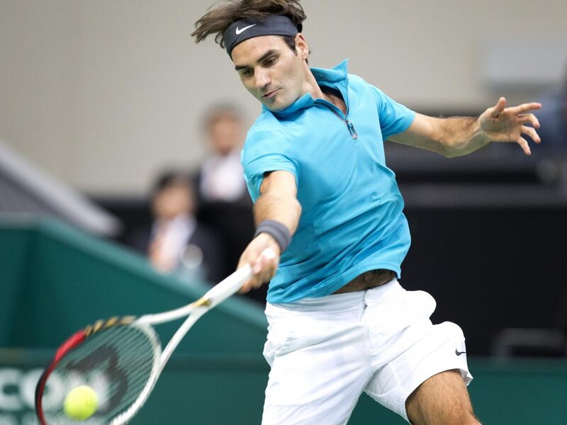 Tennis Player Hitting Ball — Blue, Focused, Photograph, Tennis Racket