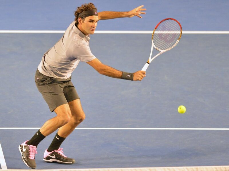Tennis Player Hitting Ball — Blue, Focused, Photograph