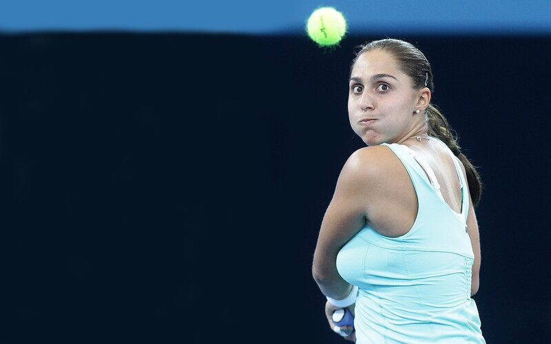 Tennis Player Hitting Ball — Blue
