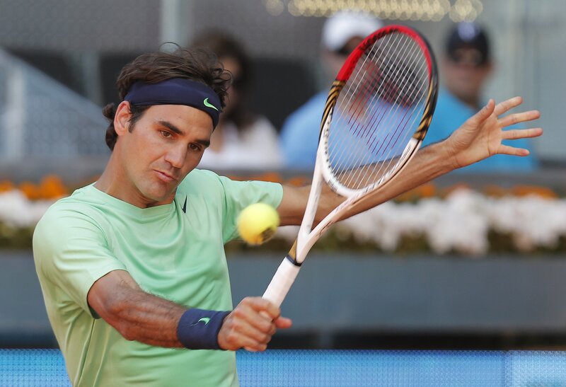 Tennis Player Hitting Ball — Green, Focused, Afternoon