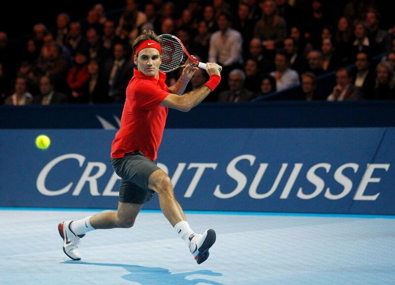 Tennis Player Hitting Ball — Red