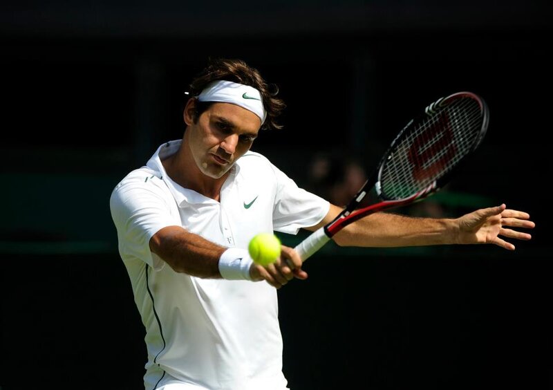 Tennis Player Hitting Ball — White, Focused, Afternoon