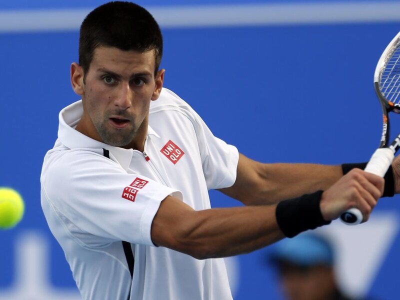 Tennis Player Hitting Ball — White, Focused, Photograph
