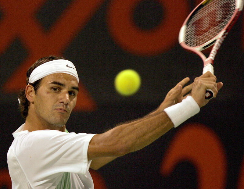 Tennis Player Hitting Ball — White