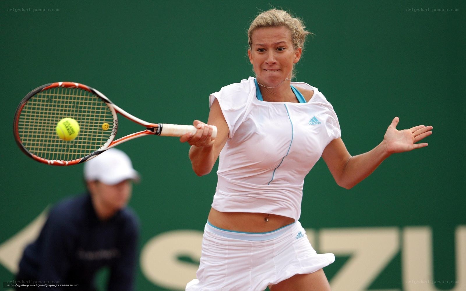 tennis player hitting ball
