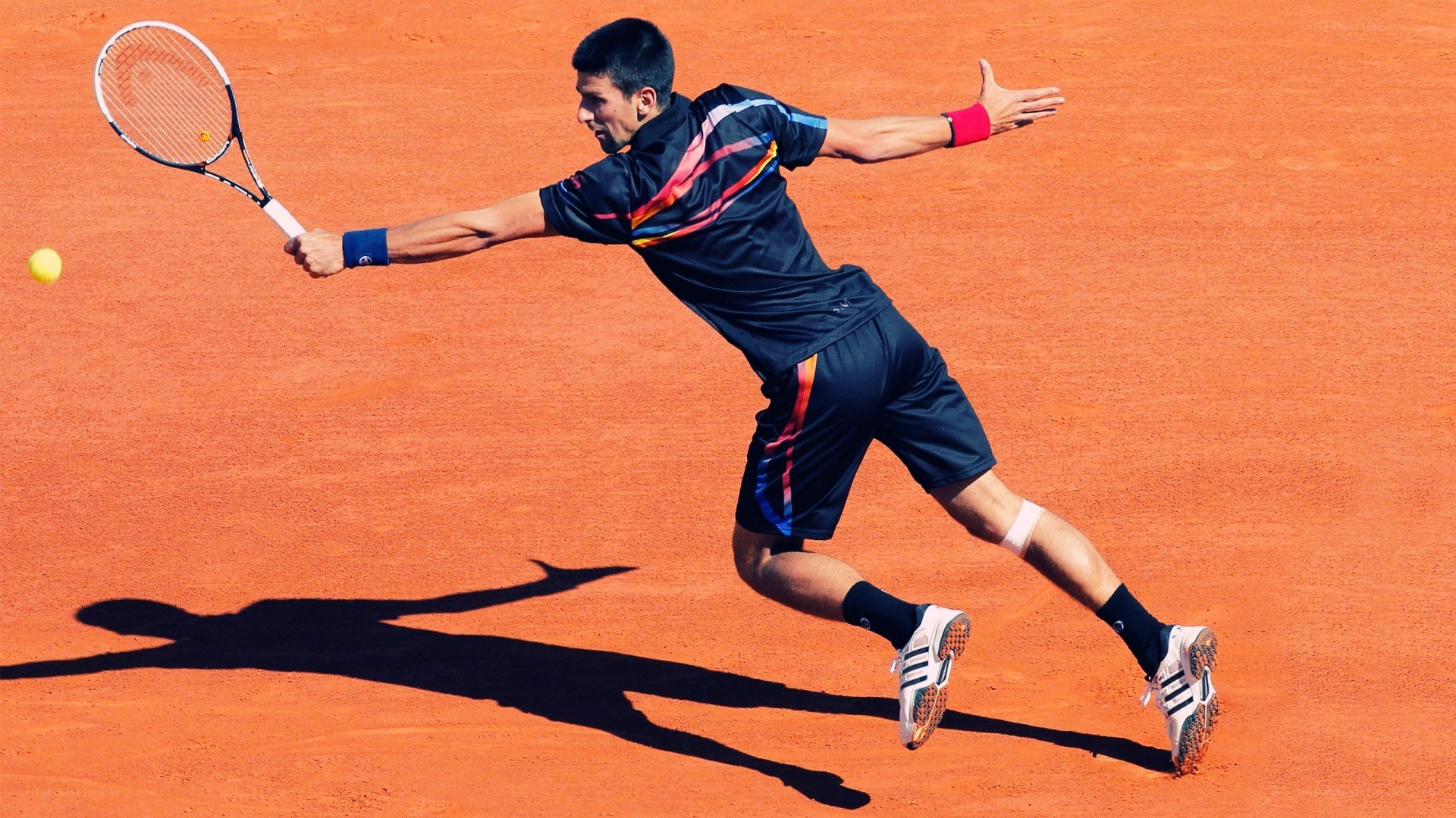 tennis player hitting forehand