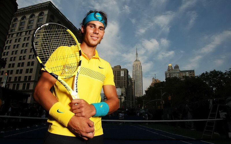 Tennis Player Holding Racket — Yellow, Confident