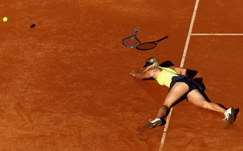 Tennis Player on Clay Court — Brown