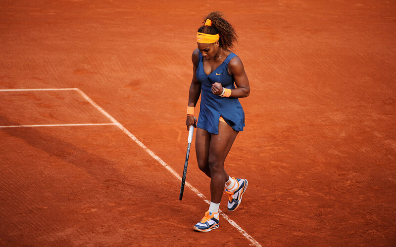 Tennis Player on Clay Court — Orange