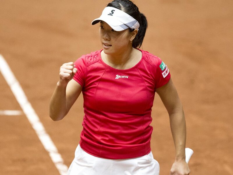 Tennis Player on Clay Court — Red