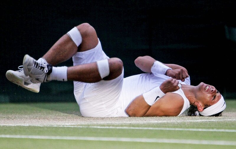 Tennis player on grass court