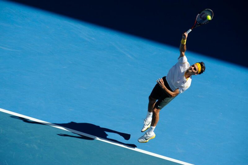 Tennis Player Serving — Blue