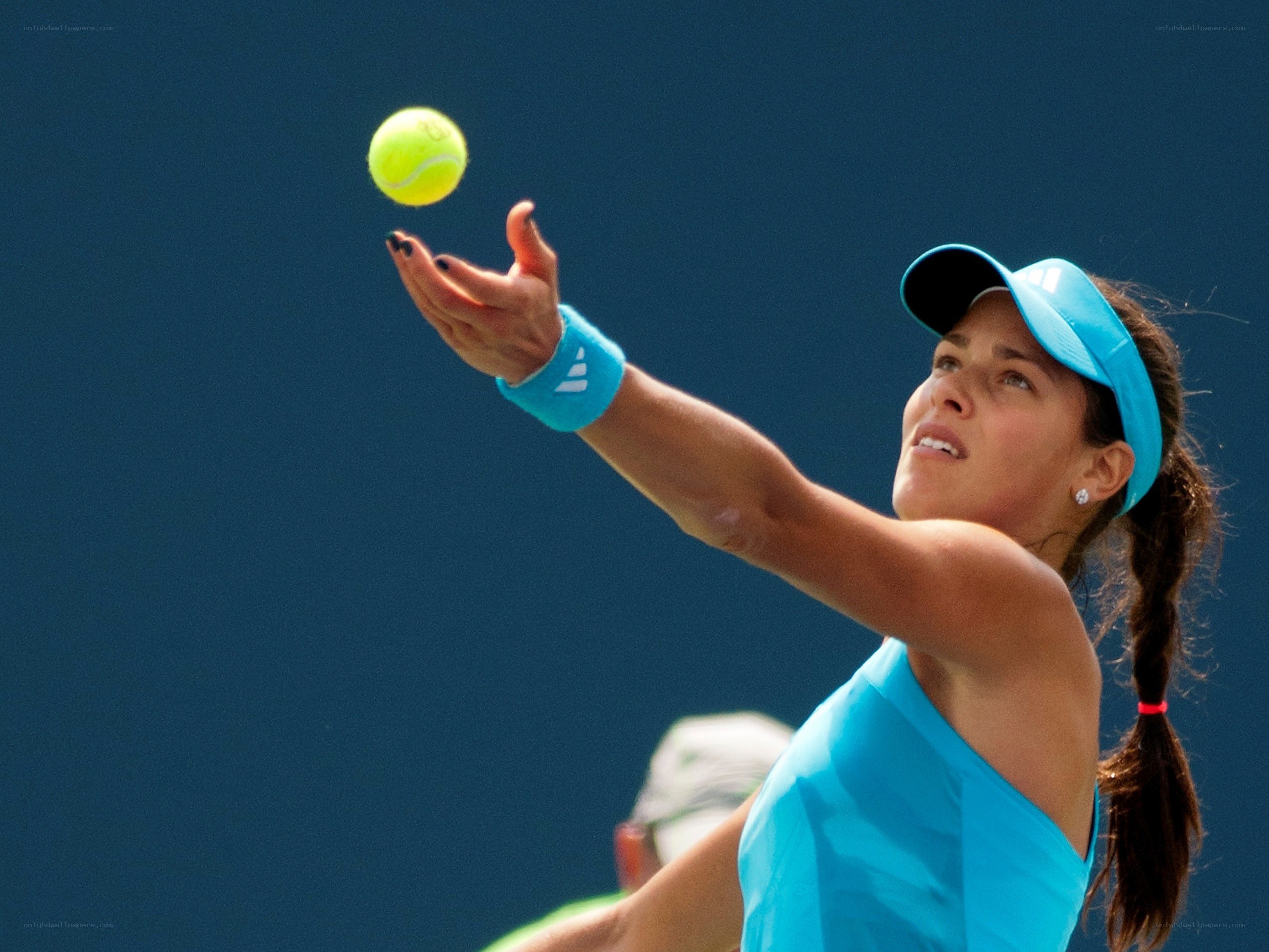 Tennis player serving the ball