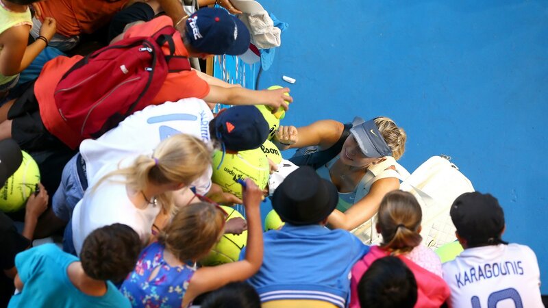 tennis player signing autographs