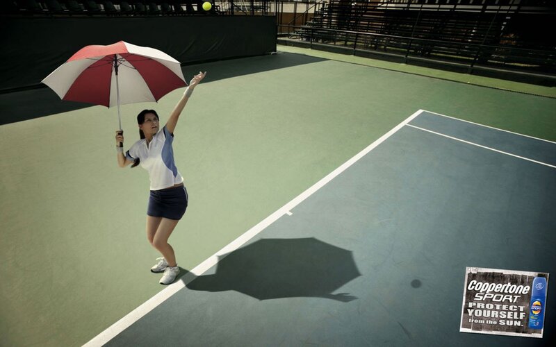 Tennis player with umbrella