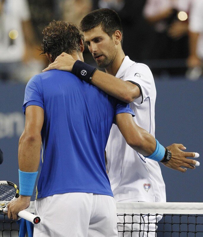 tennis players embrace after match