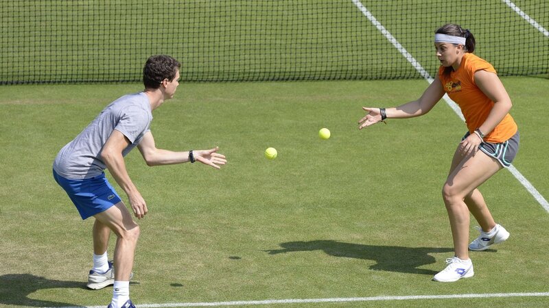 tennis players on grass court