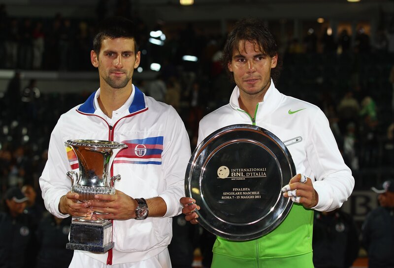 Tennis players with trophies